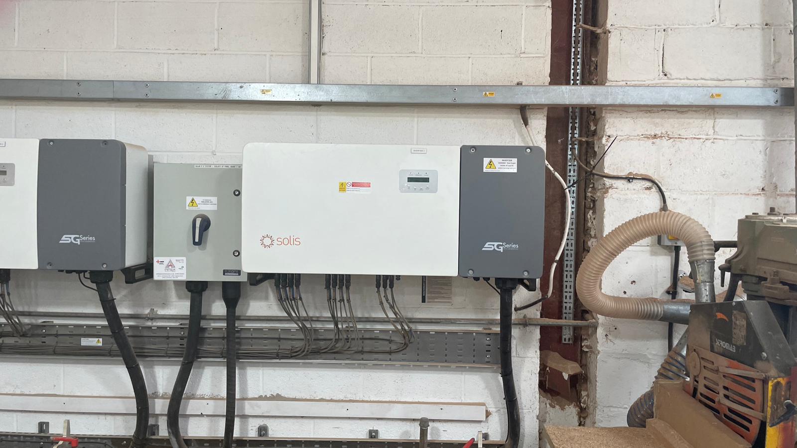 Row of commercial solar PV inverters maintained by Myriad